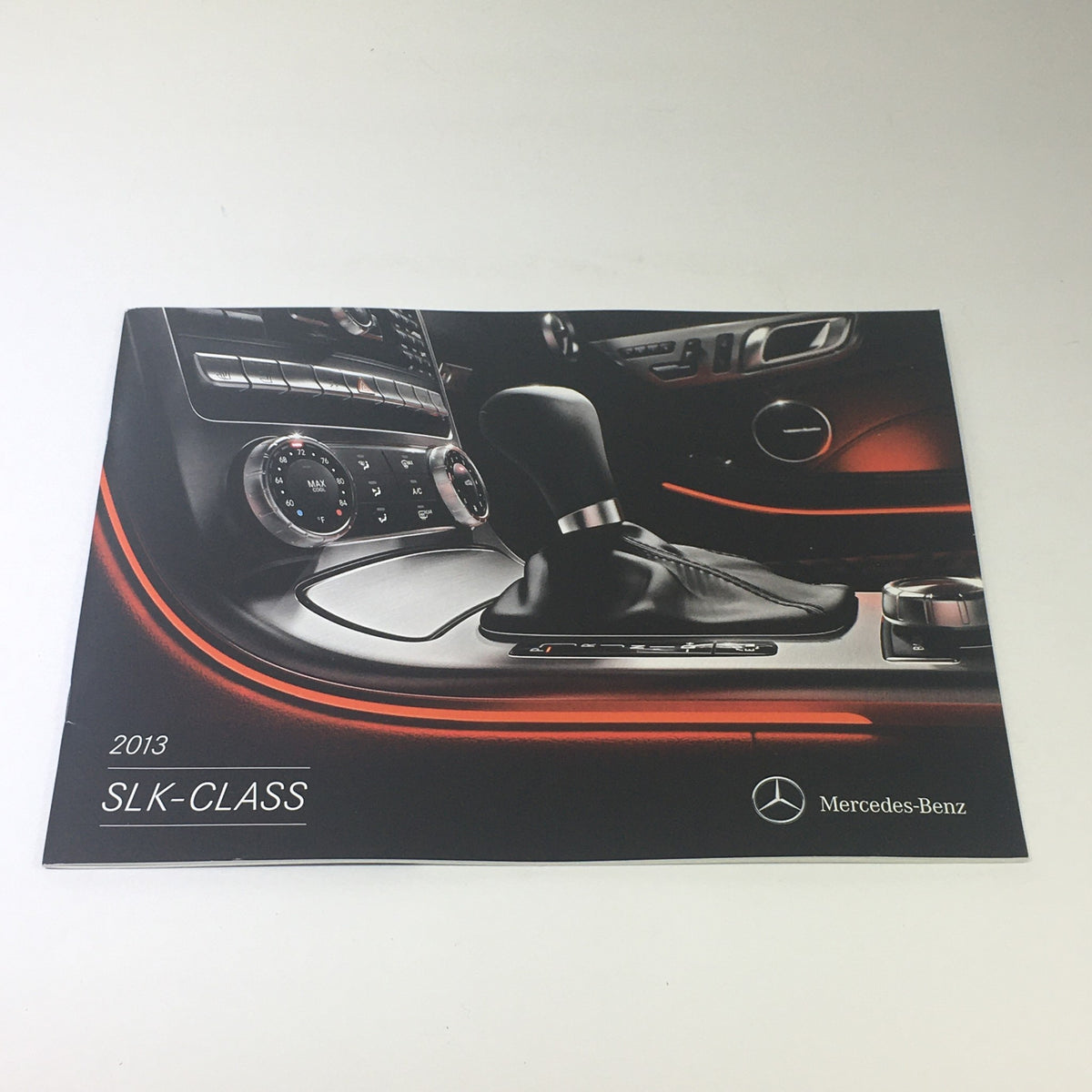 2013 Mercedes-Benz SLK-Class Dealership Car Auto Brochure Catalog cover featuring the sleek interior design and gear shift.