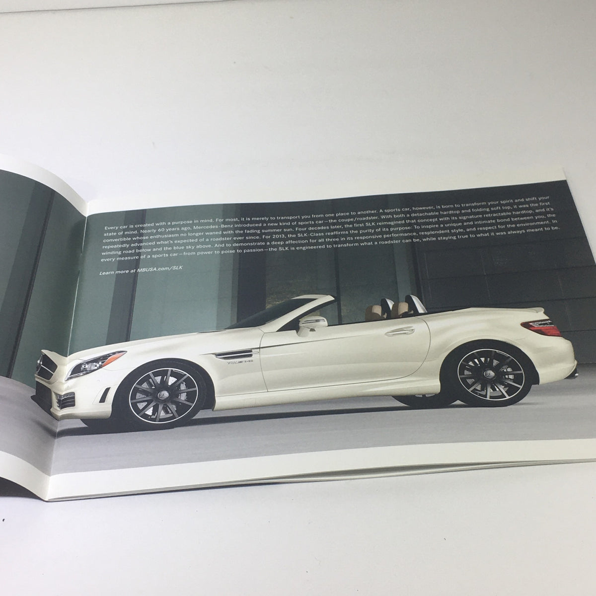 Page from the 2013 Mercedes-Benz SLK-Class Dealership Car Auto Brochure Catalog displaying a white SLK-Class convertible.