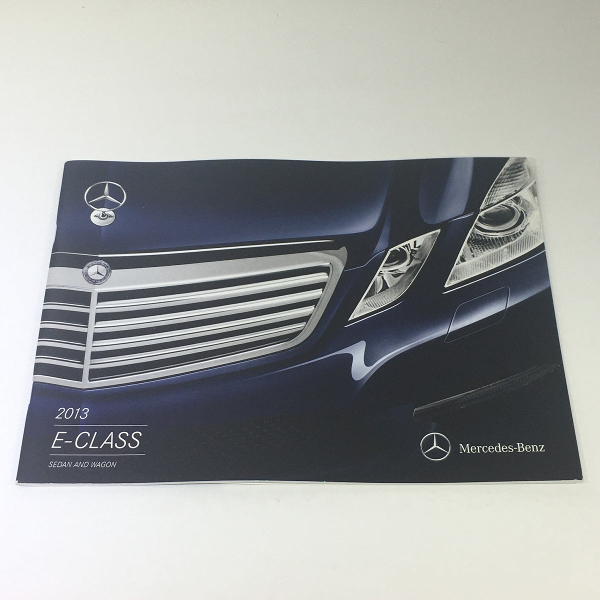 2013 Mercedes-Benz E-Class Sedan and Wagon Dealership Car Auto Brochure Catalog cover showcasing the iconic grill and logo.