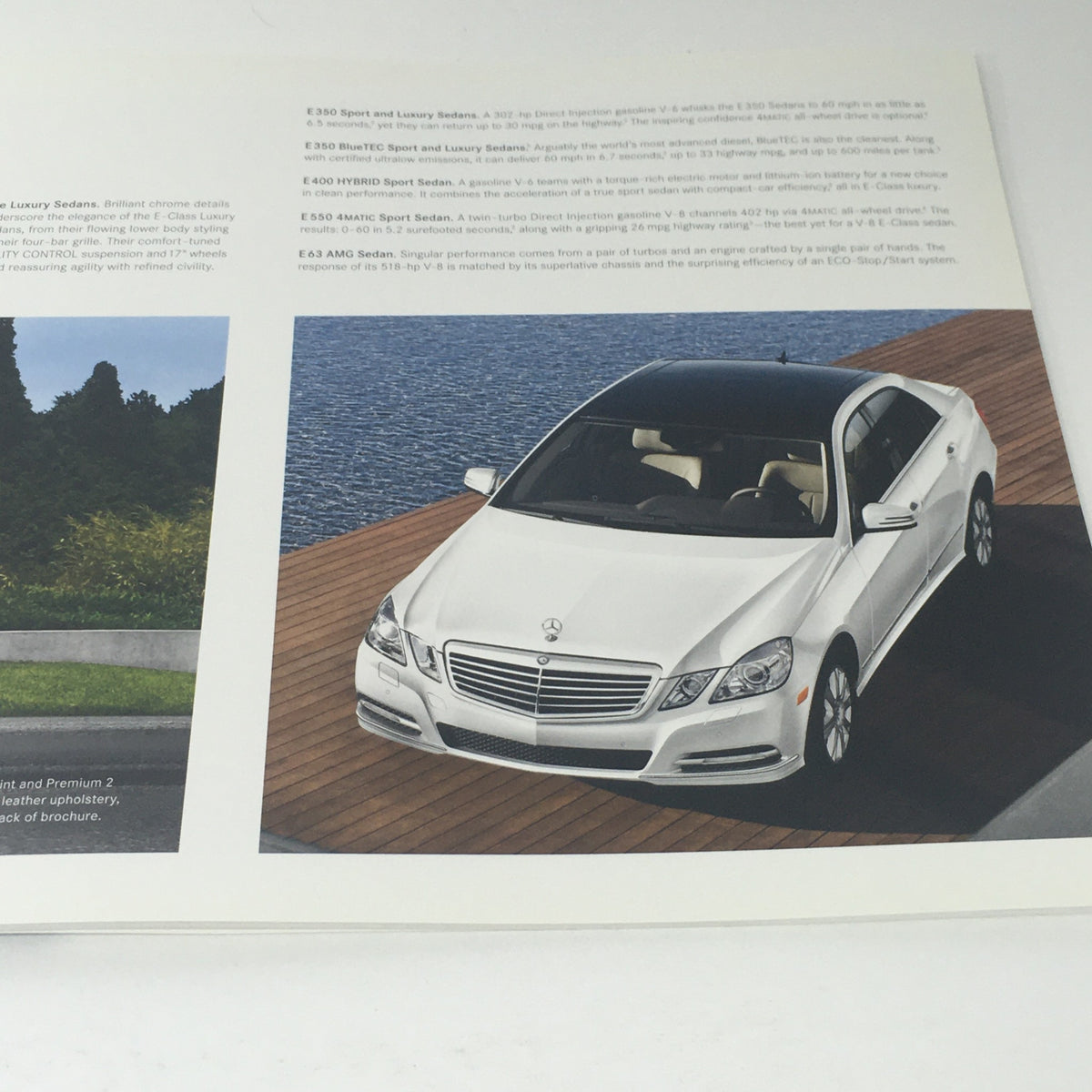 2013 Mercedes-Benz E-Class Sedan and Wagon Dealership Car Auto Brochure Catalog image showing the white luxury sedan with detailed specifications.