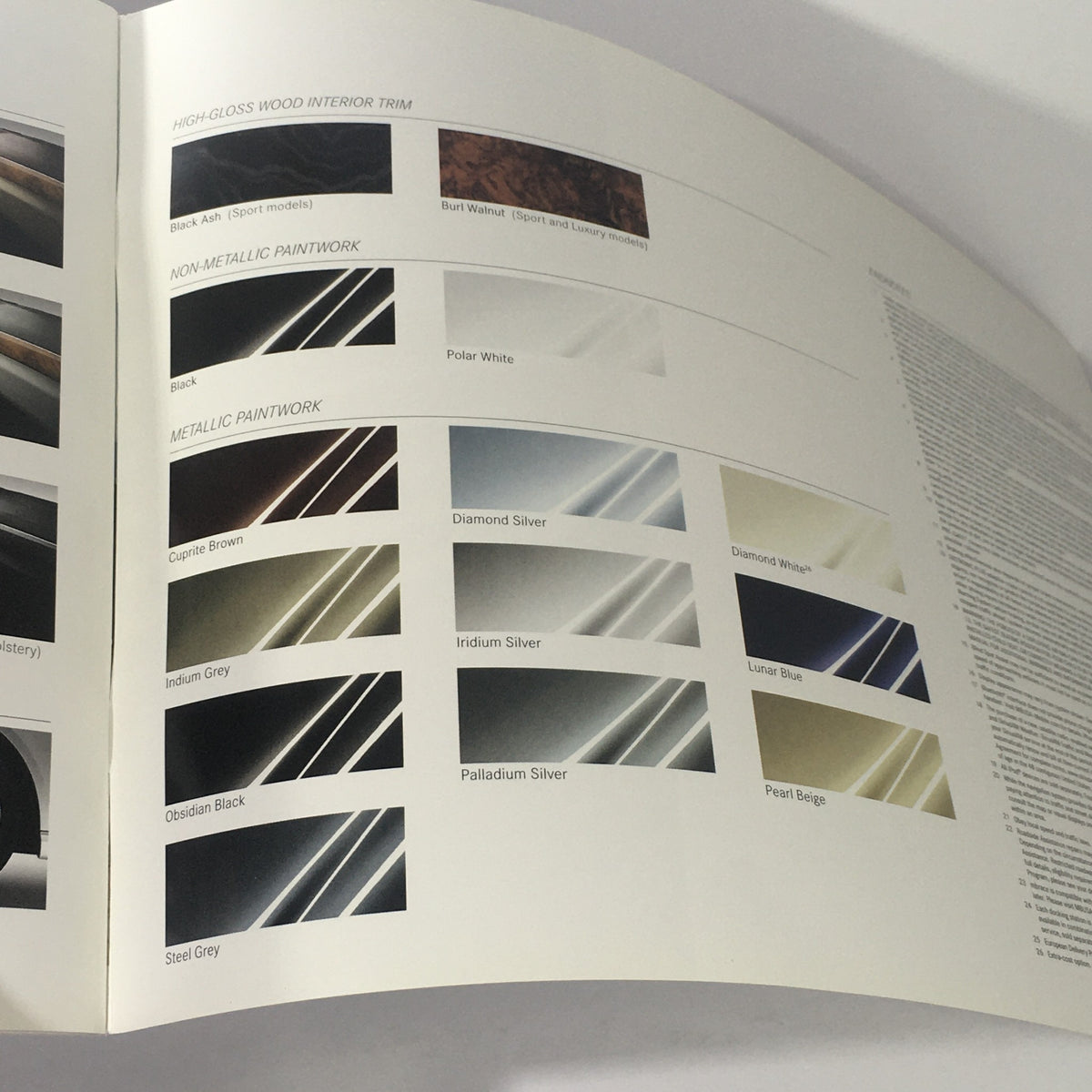 2013 Mercedes-Benz E-Class Sedan and Wagon Dealership Car Auto Brochure Catalog image displaying wood interior trim and paint options available for the vehicle.