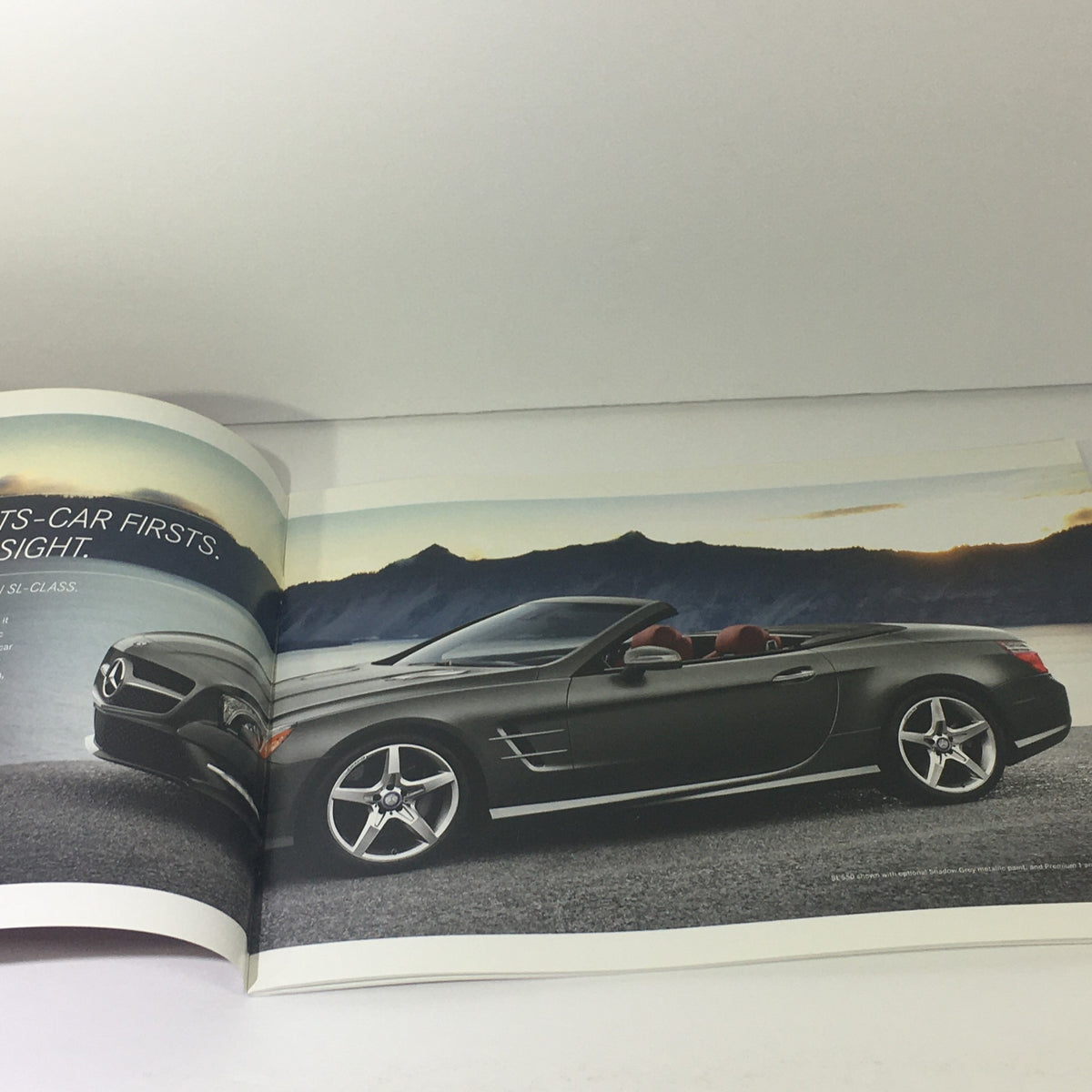 2013 Mercedes-Benz SL-Class Dealership Car Auto Brochure Catalog showcasing the sleek exterior design of the SL-Class convertible against a scenic backdrop.