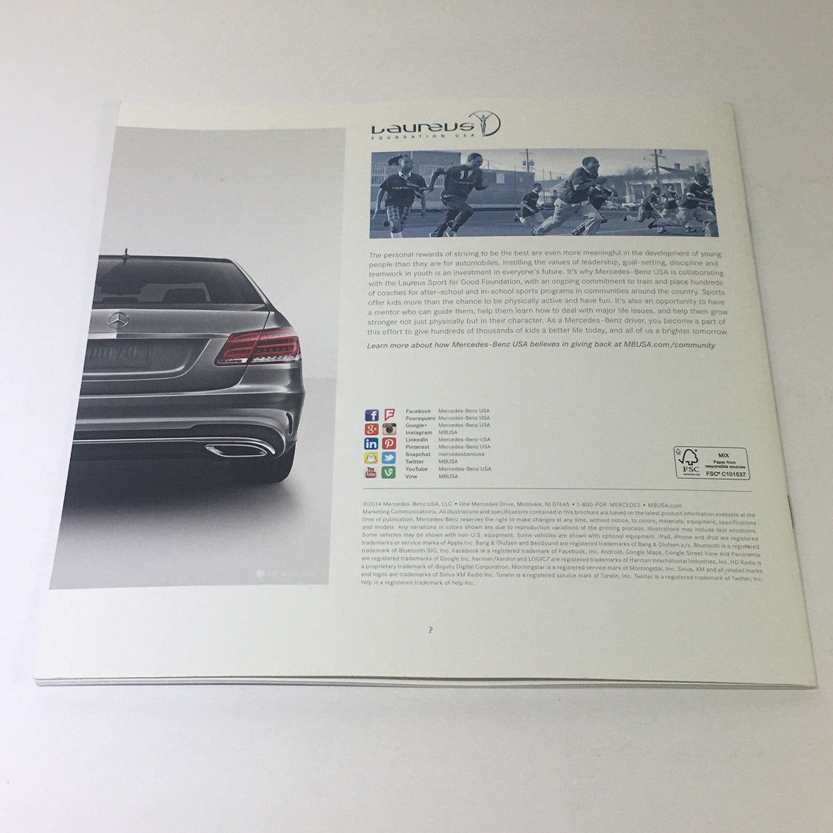 2015 Mercedes-Benz E-Class Sedans & Wagon Dealership Car Auto Brochure Catalog revealing the back view of an E-Class sedan with an overview of Mercedes-Benz community engagement.