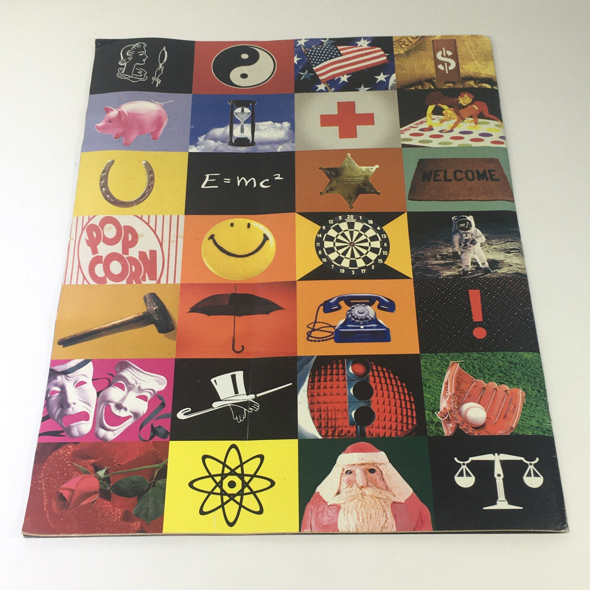 Back cover of the 1997 Mercedes-Benz CLK-30 C-230 Sedan Dealership Car Auto Brochure Catalog featuring a collage of various symbols and images.