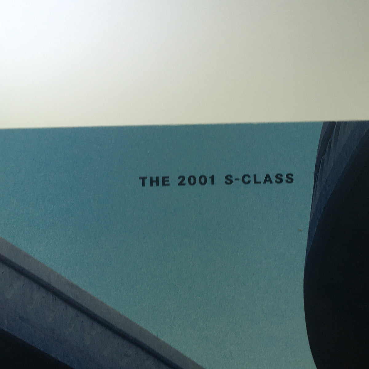 Detail of the cover of the 2001 Mercedes-Benz S-Class Dealership Car Auto Brochure Catalog featuring the text 'THE 2001 S-CLASS' prominently displayed.