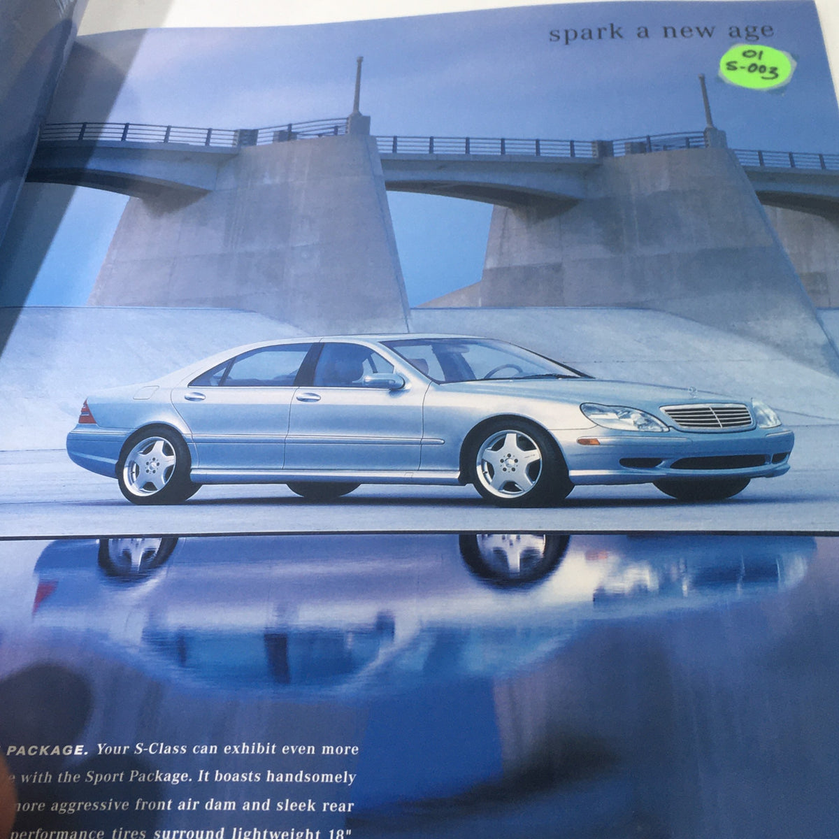 Image of a 2001 Mercedes-Benz S-Class displayed in the dealership car brochure, featuring the stylish silver exterior and modern design, labeled S-005.