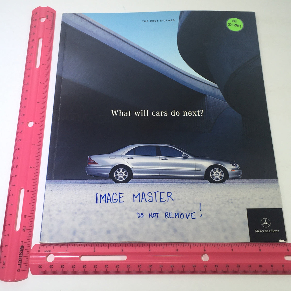 Front cover of the 2001 Mercedes-Benz S-Class Dealership Car Auto Brochure Catalog featuring a sleek Mercedes-Benz S-Class and the question 'What will cars do next?'.