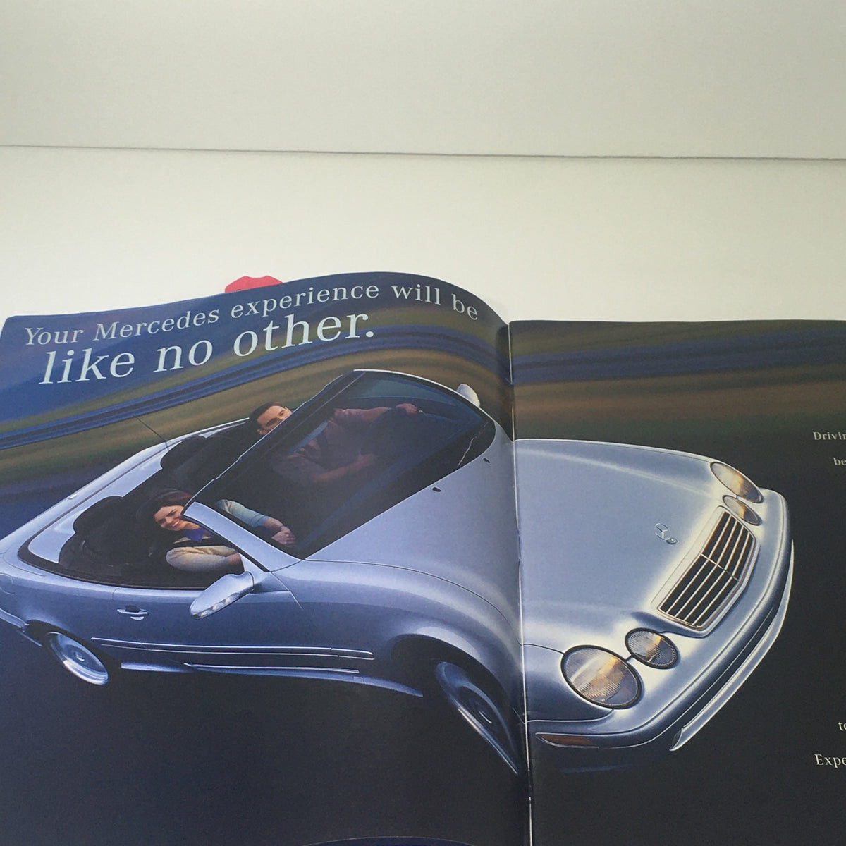 2001 Mercedes-Benz SLK-Class Dealership Car Auto Brochure Catalog showcasing an open page with a silver convertible and the phrase 'Your Mercedes experience will be like no other.'
