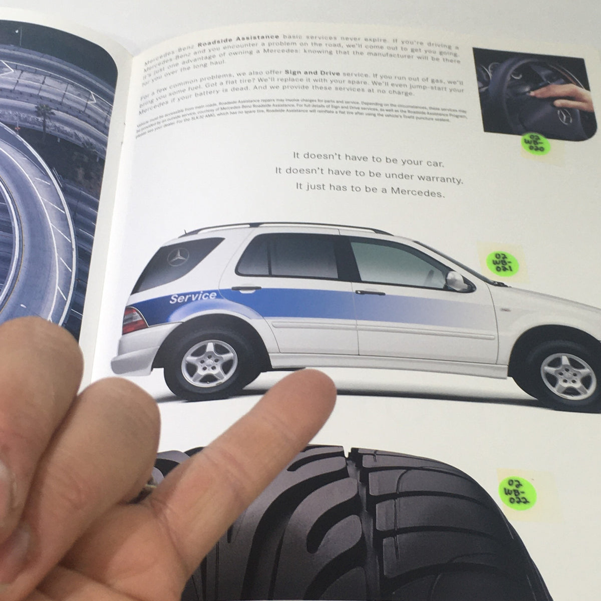 Page of the 2001 Mercedes-Benz E-Class Dealership Car Auto Brochure Catalog showing a Mercedes car and a close-up of a tire, highlighted with sticky notes.