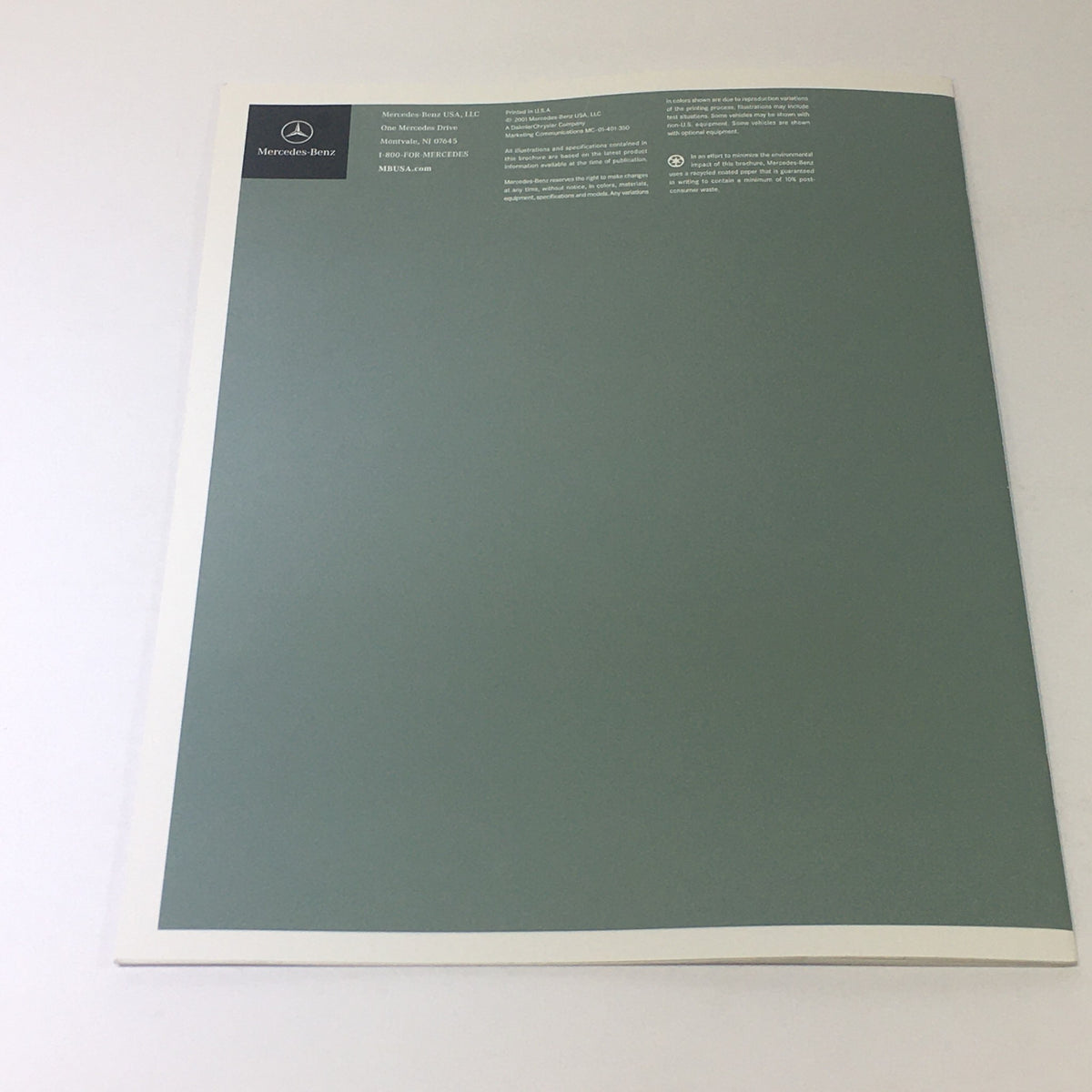 Back cover of the 2001 Mercedes-Benz E-Class Dealership Car Auto Brochure Catalog, featuring a smooth gray surface with Mercedes-Benz branding.