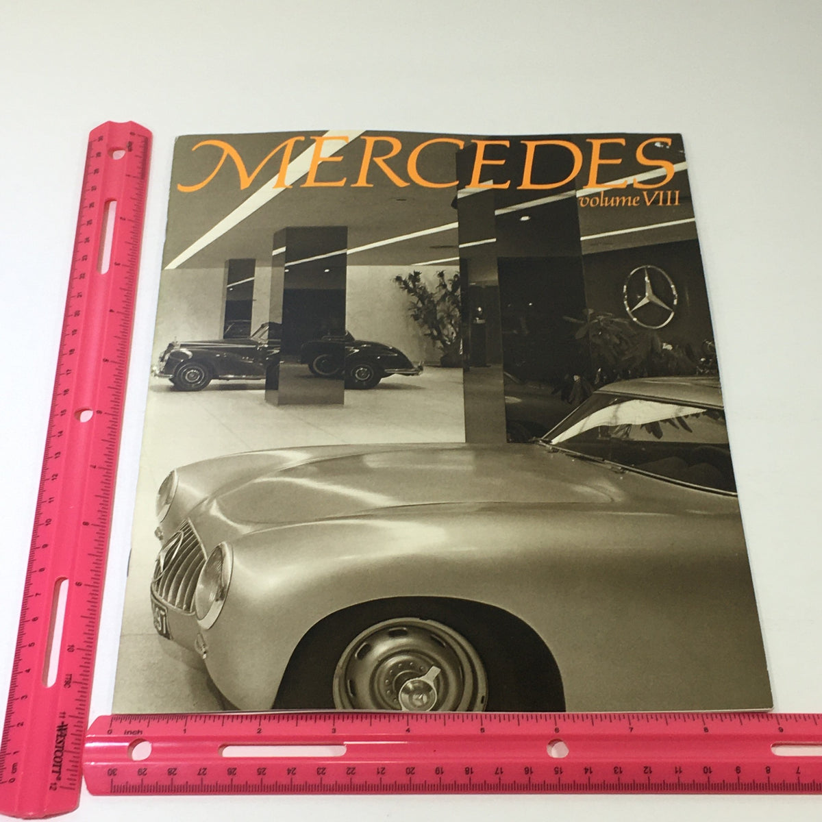 Cover of the 1983 Mercedes-Benz Volume VIII Dealership Car Auto Brochure, featuring a sleek Mercedes car and artistic reflections in a stylish dealership environment.
