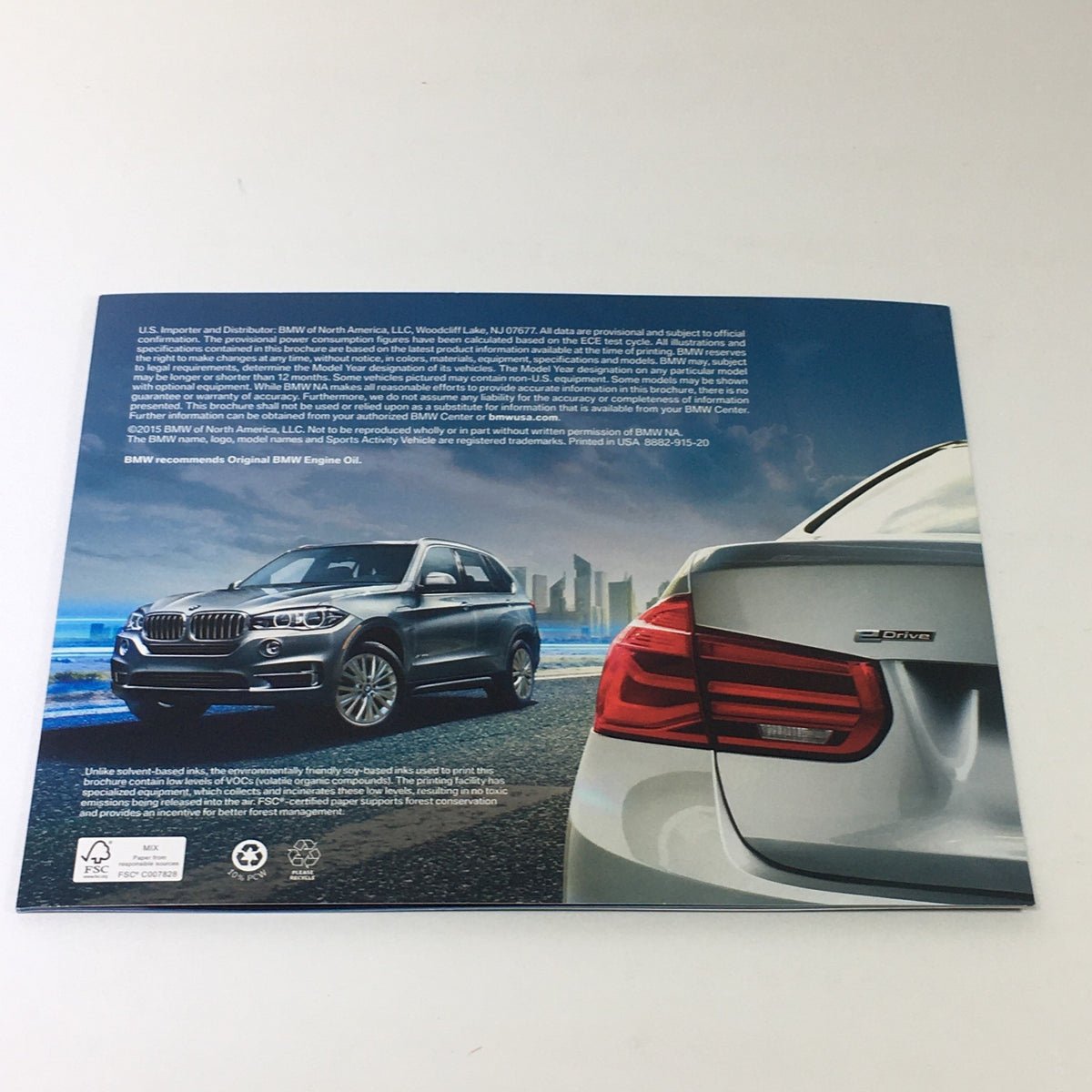 2015 BMW eDrive Technology 330e X5 Sedan Dealership Car Auto Brochure Catalog featuring the rear view of the BMW X5 and 330 sedan, highlighting design and performance.