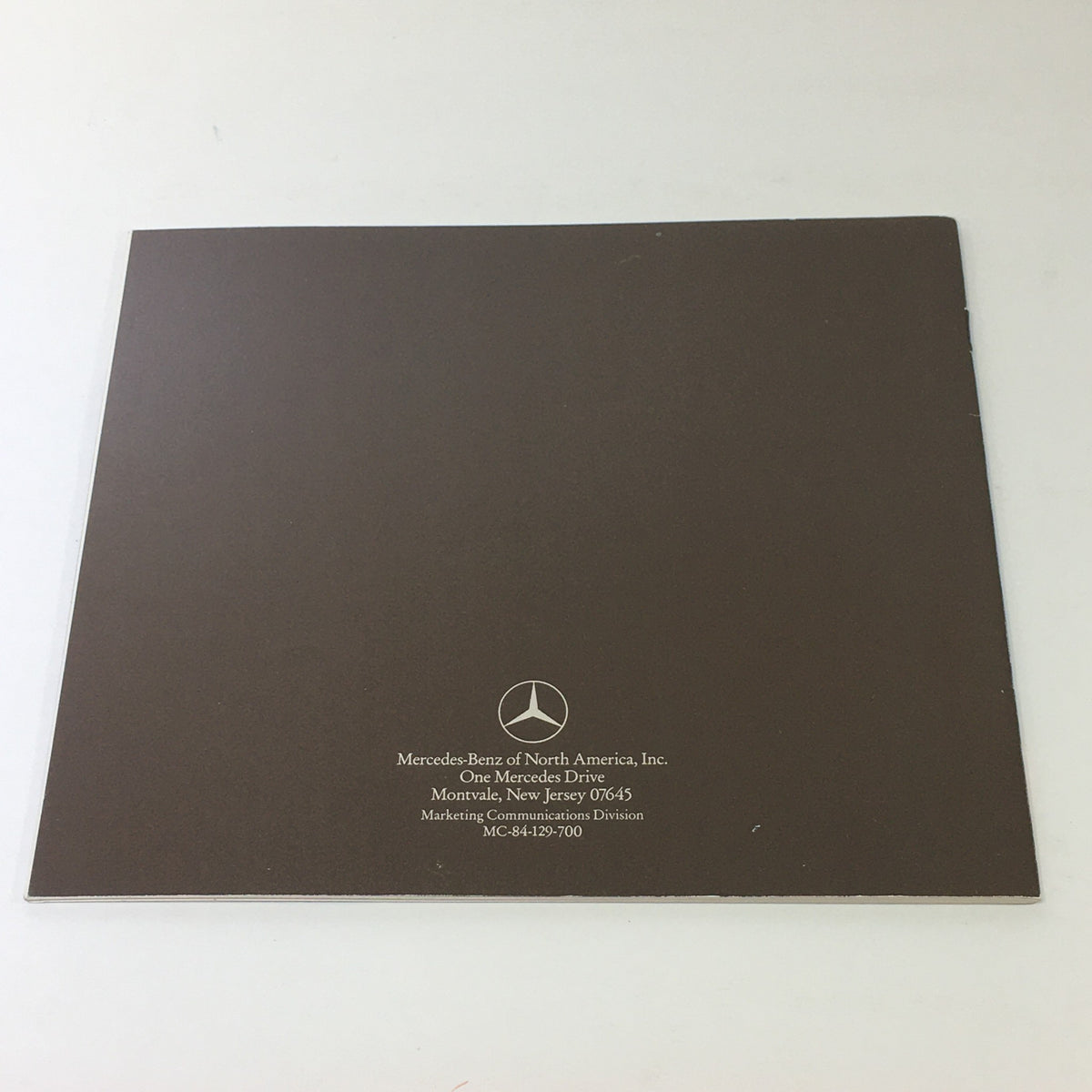 1985 Mercedes-Benz SD SE SL SEL SEC Class Dealership Car Auto Brochure Catalog back cover featuring the Mercedes-Benz logo and company information, representing authenticity for collectors.