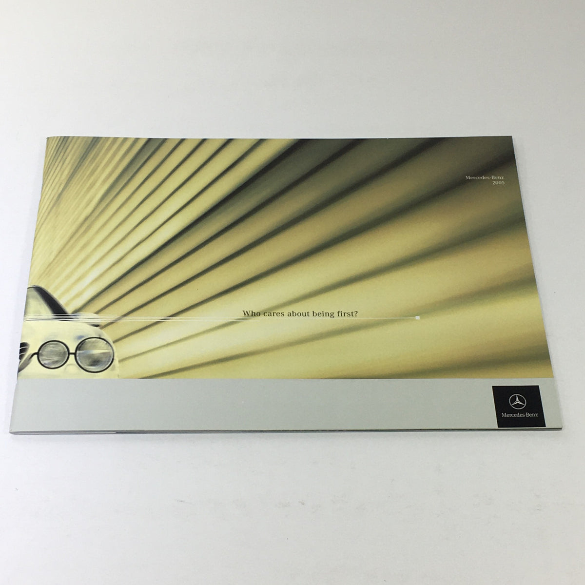 2005 Mercedes-Benz CLK-Class Dealership Car Auto Brochure Catalog cover featuring an abstract design and the tagline 'Who cares about being first?'.
