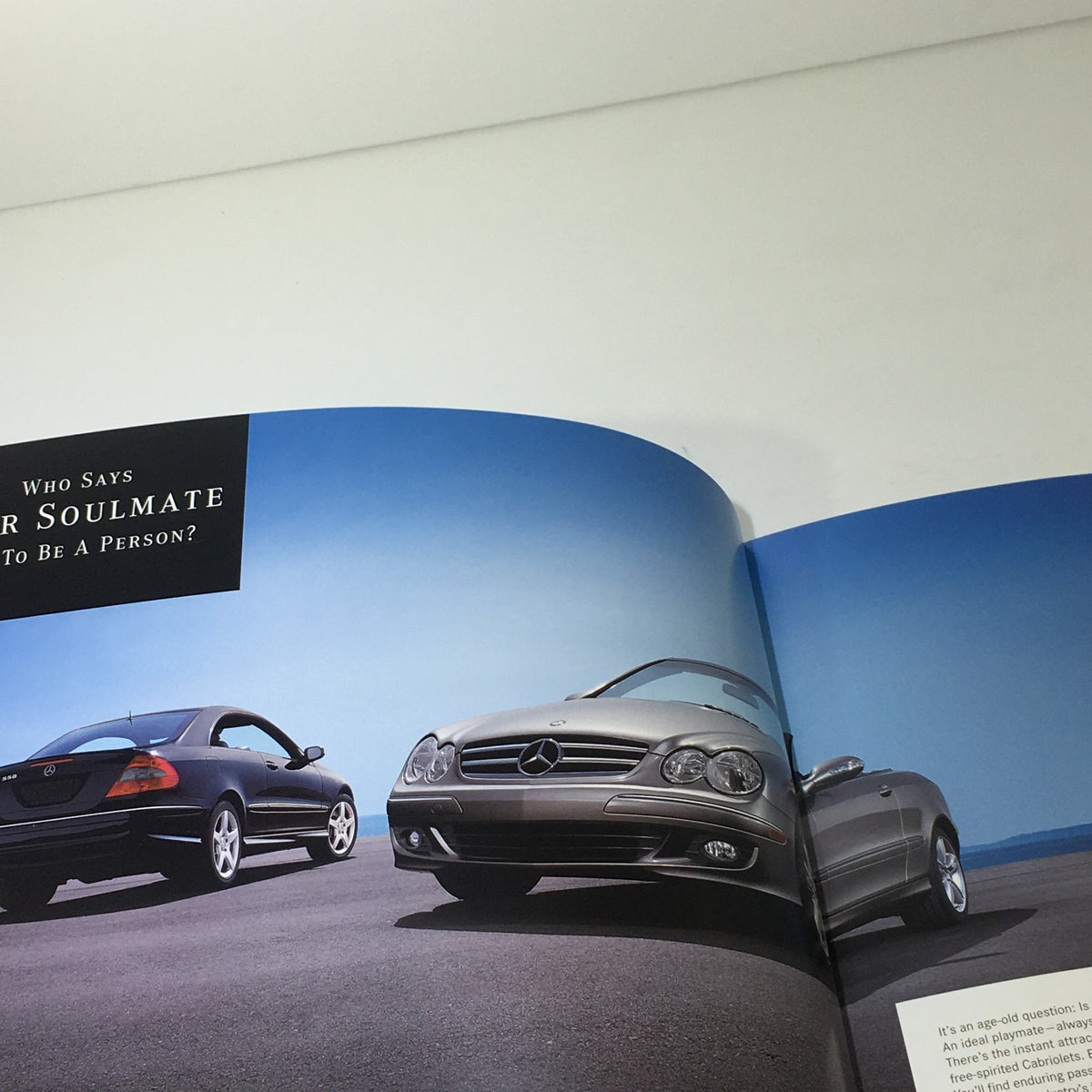 Spread from the 2007 Mercedes-Benz CLK-Class dealership auto brochure depicting two CLK-Class models on an open road.