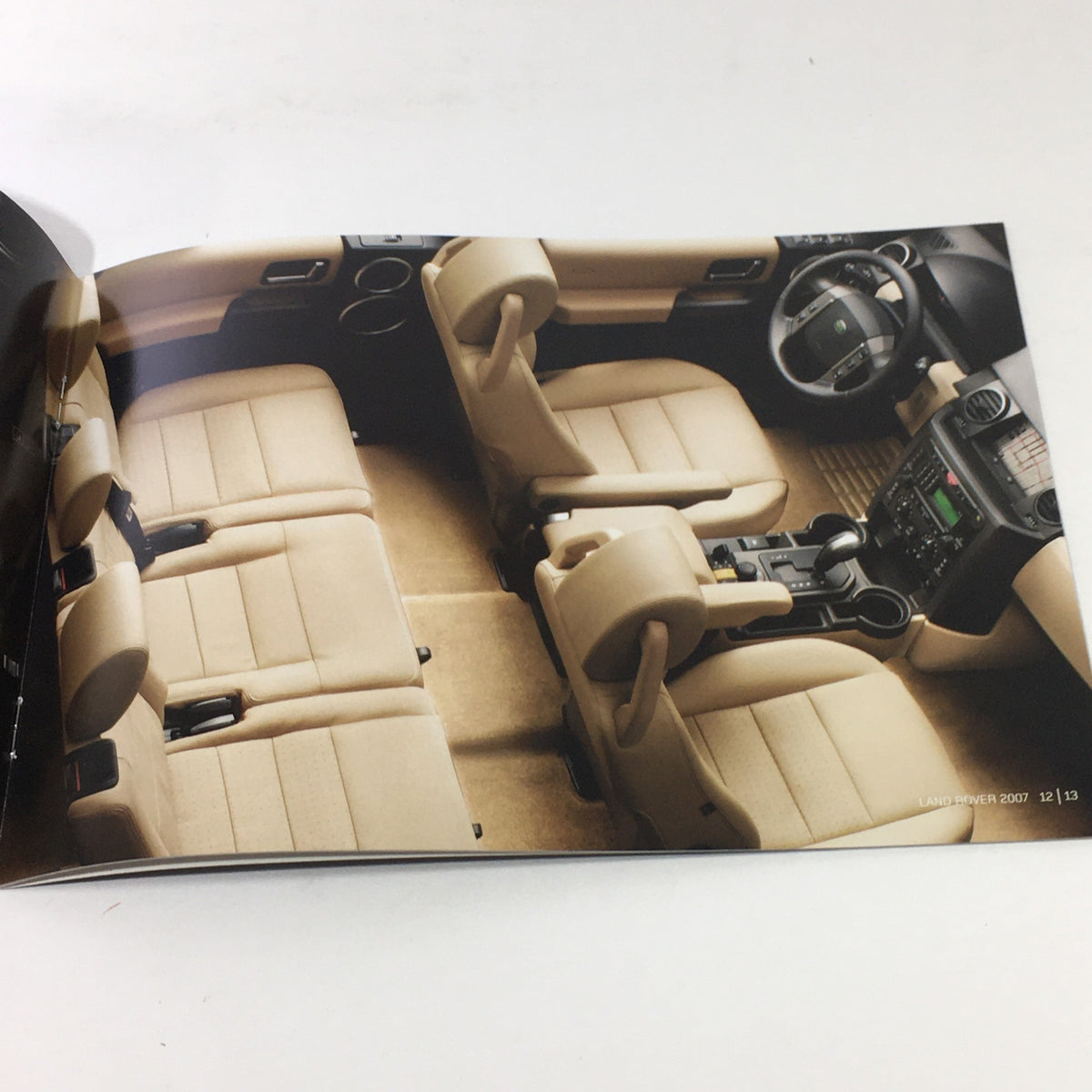 Interior layout of a 2007 Land Rover depicted in the American Cherry Dealership Car Auto Brochure Catalog, featuring a luxurious seating arrangement.