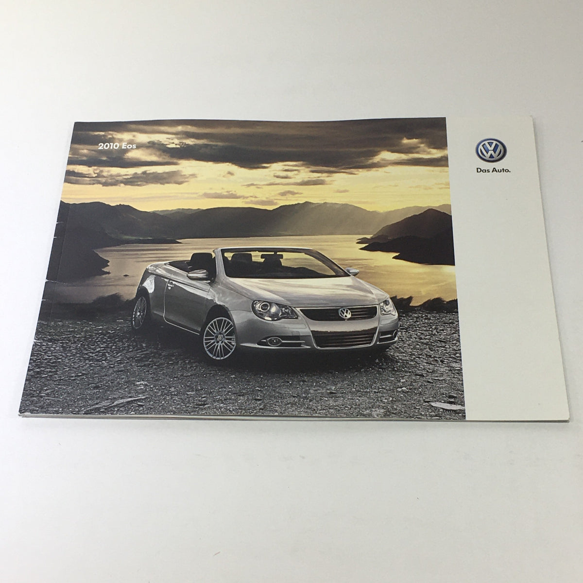 2010 Volkswagen Eos Dos Auto Dealership Car Auto Brochure Catalog showcasing the front cover with scenic background.