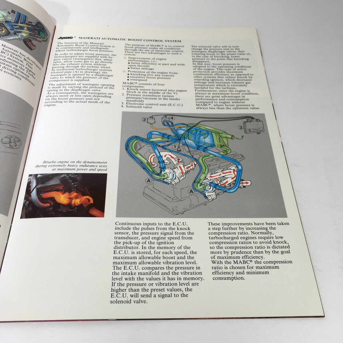 Inside page of the 1985 Maserati Biturbo Dealership Car Auto Brochure Catalog detailing the Maserati Automatic Boost Control System with diagram.