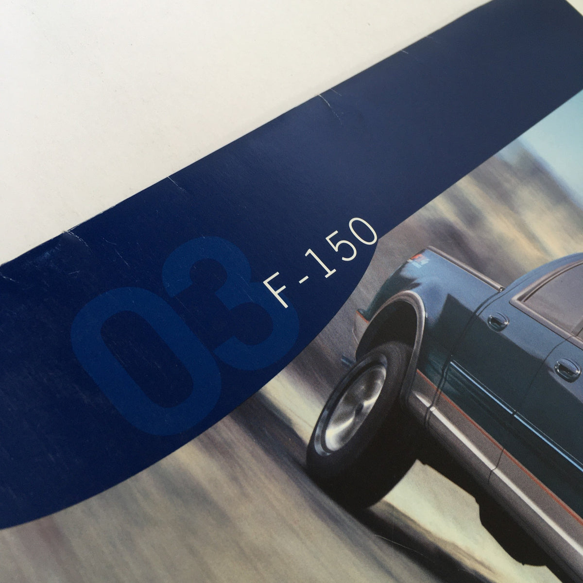 Cover detail of the 2003 Ford F-150 4x4 Pickup Dealership Car Auto Brochure Catalog featuring the pickup truck's model identifier.