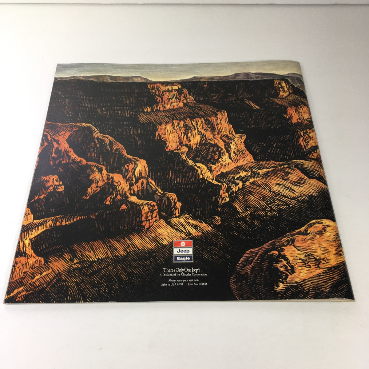 1995 The Jeep Book Dealership Car Auto Brochure Catalog back cover showcasing a scenic landscape with a Jeep and Eagle logo, emphasizing the Jeep brand heritage.