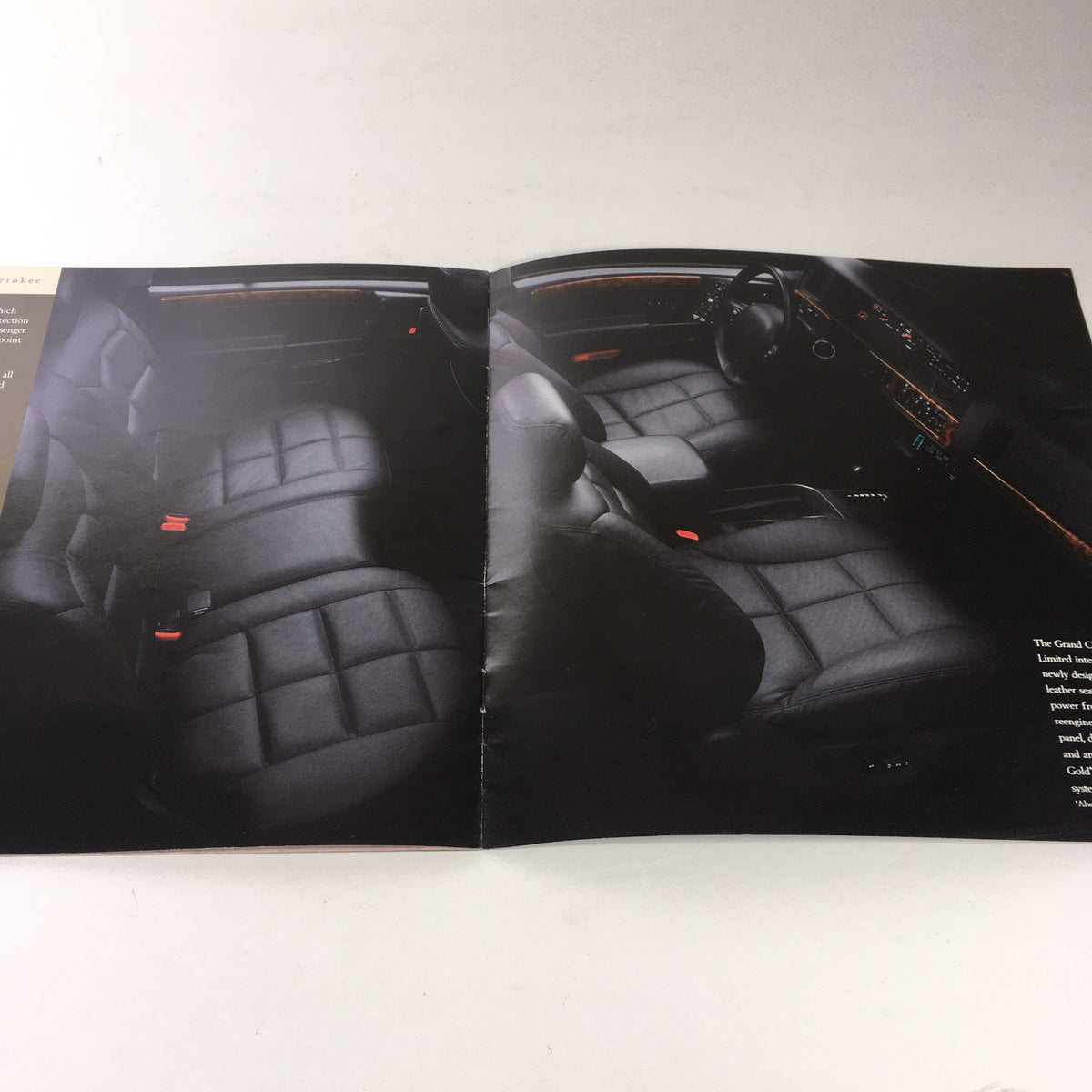 Interior view of a 1996 Jeep TJ Wrangler and CJ-2A showcasing the spacious seating arrangement in a dealership brochure.