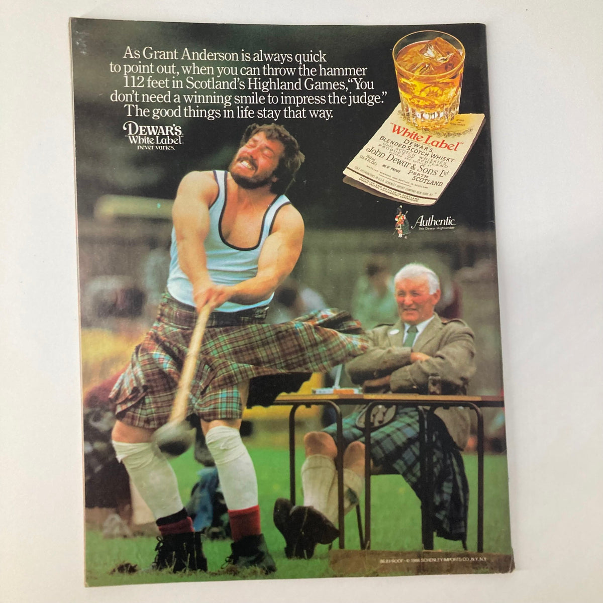 VTG Newsweek Magazine May 19 1986 featuring an advertisement for Dewar's White Label whisky, showcasing a man throwing a hammer at Scotland's Highland Games, with a quote about impressing the judge.