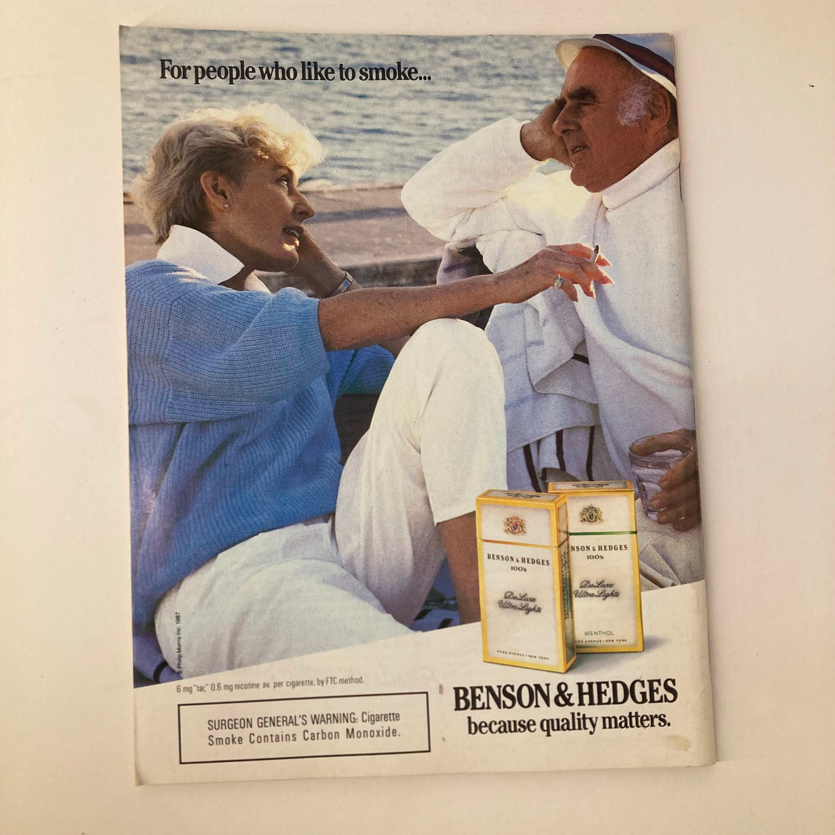 Vintage advertising featuring a couple enjoying a moment by the water, promoting Benson & Hedges cigarettes, with a message emphasizing quality. Related to the VTG Newsweek Magazine from June 22, 1987, featuring Robert De Niro as Al Capone in The Untouchables.