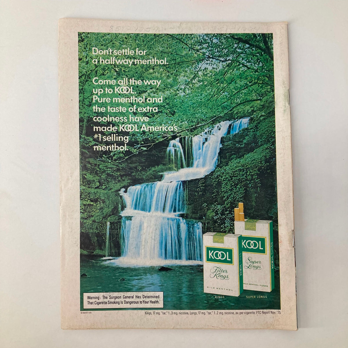 Back cover of the Newsweek magazine from March 1, 1976, featuring an advertisement for KOOL menthol cigarettes, showcasing a serene waterfall backdrop with branding and health warning.
