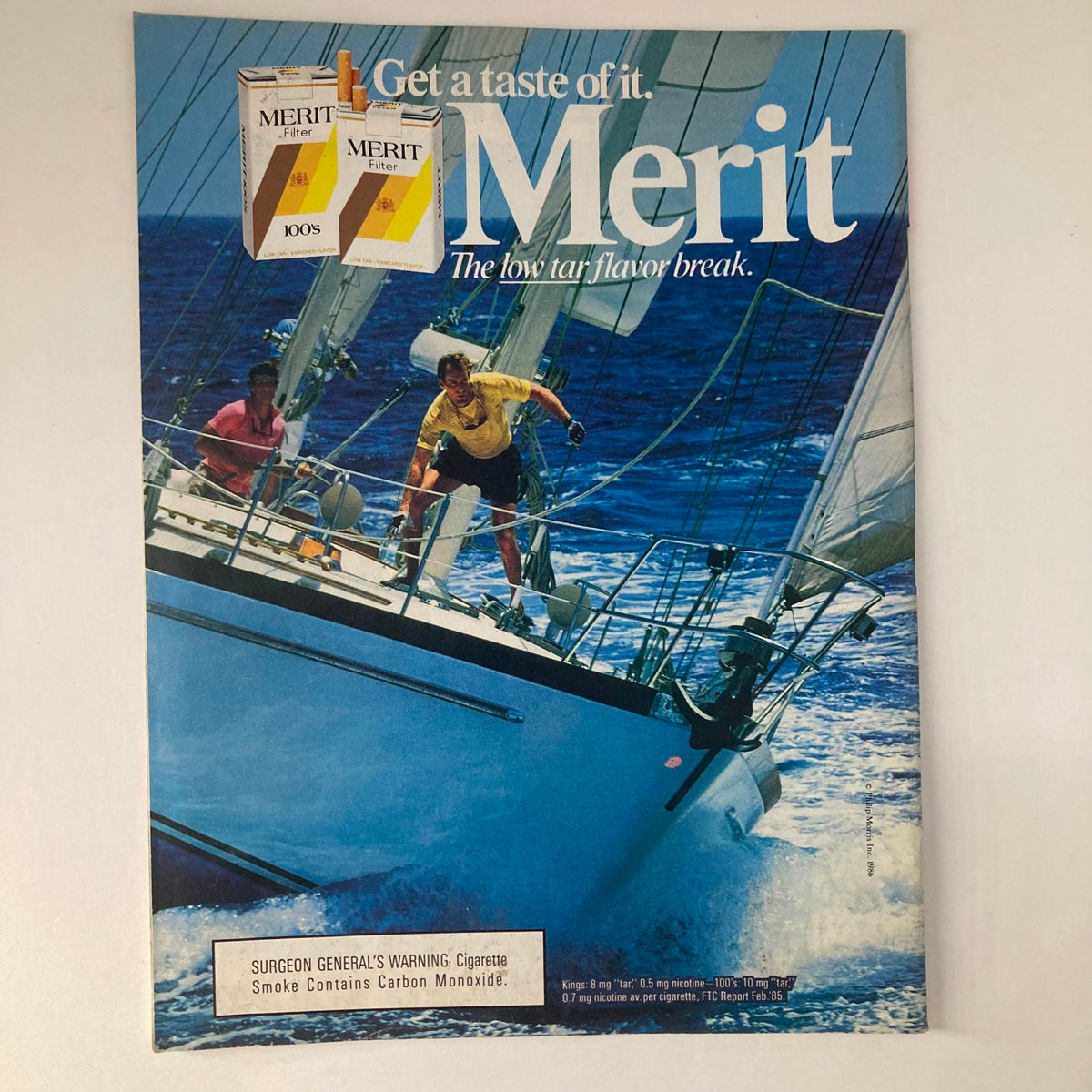 Cover of VTG Newsweek Magazine July 7 1986 featuring a vintage advertisement for Merit cigarettes with two men sailing on a yacht in a vibrant blue ocean.