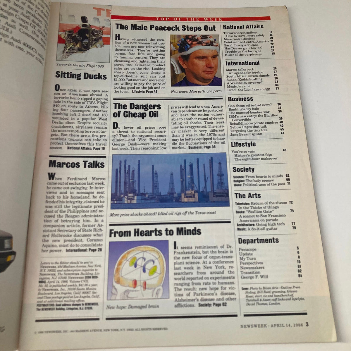 Inside page of the April 14, 1986 Newsweek magazine displaying articles and headlines such as 'The Male Peacock Steps Out' and 'The Dangers of Cheap Oil', reflecting the current events and cultural context of the time.