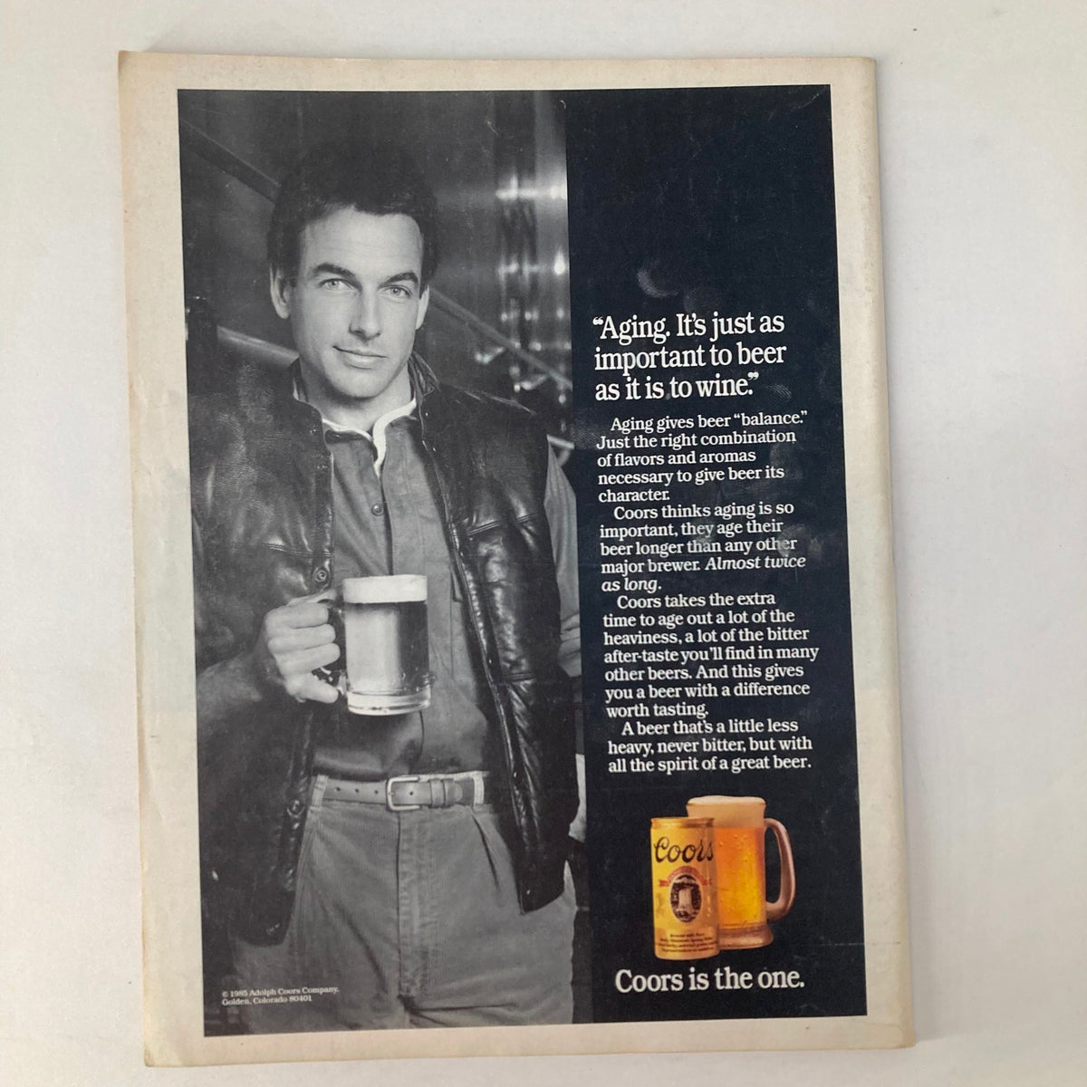 Advertisement page from the September 9, 1985 Newsweek magazine showcasing a man holding a beer mug with text emphasizing the importance of aging beer for character, presented alongside a Coors beer advertisement.
