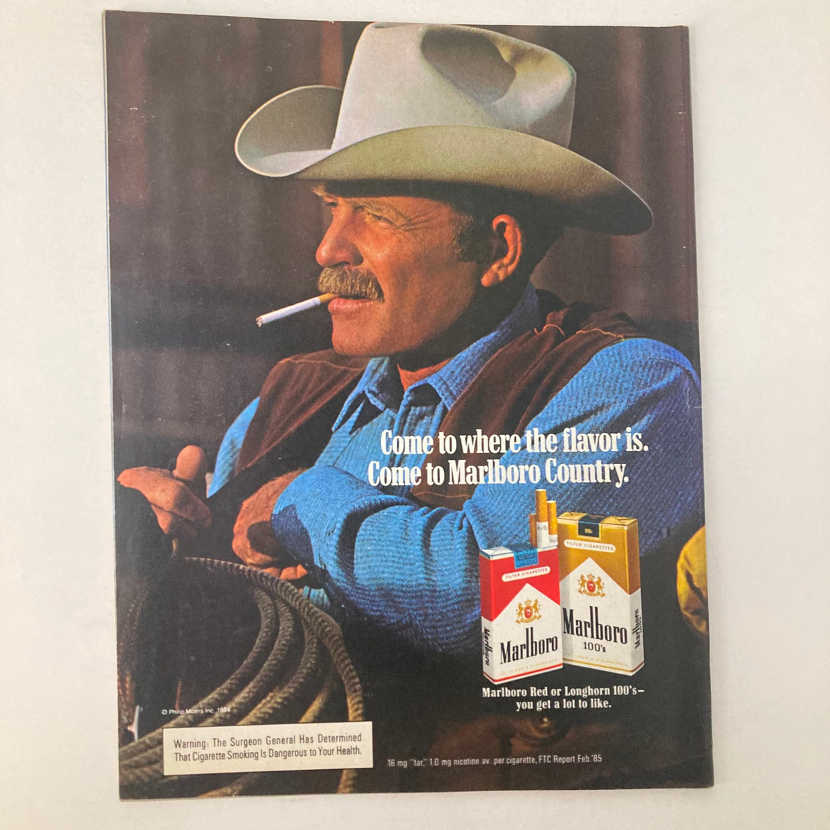 Vintage Marlboro advertisement featuring a cowboy with a cigarette, encapsulating the essence of the iconic brand with the slogan 'Come to Marlboro Country.'