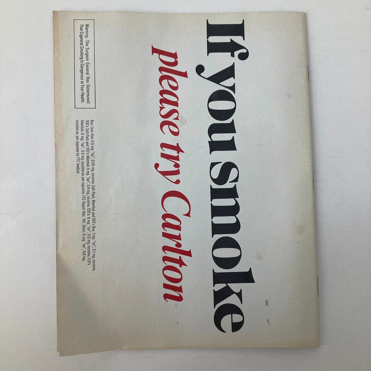 Back cover of VTG Newsweek Magazine January 7 1985 displaying an advertisement with the phrase 'If you smoke please try Carlton' in bold typography.