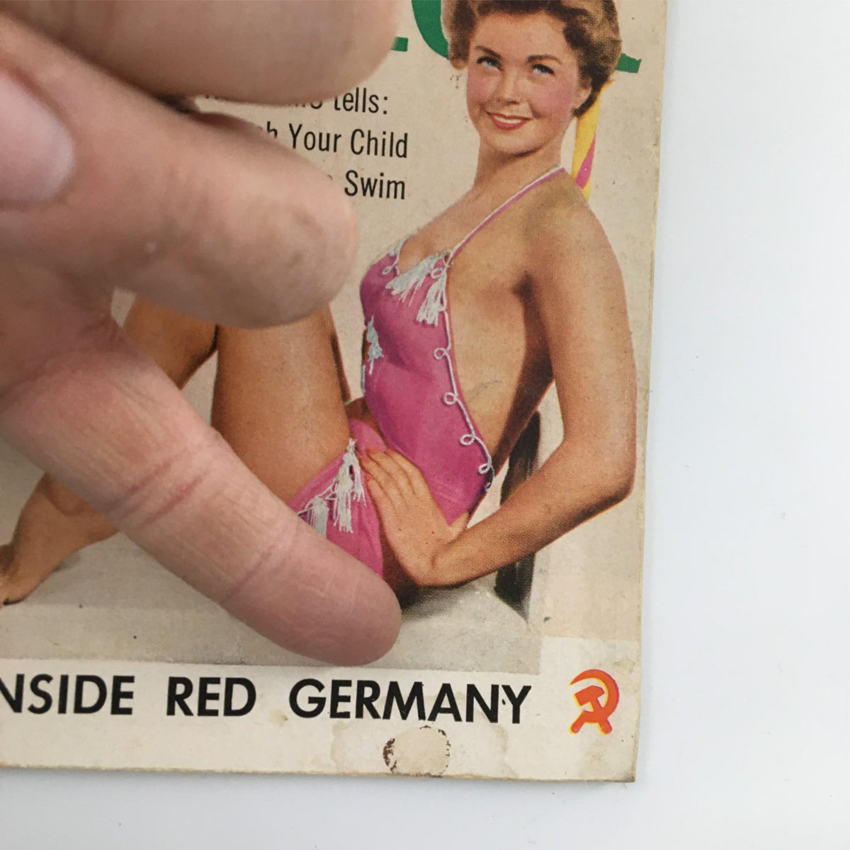 Close-up of the Quick Magazine cover from June 11, 1951 with Esther Williams, focusing on the text 'INSIDE RED GERMANY' and the magazine's pink swimsuit theme.