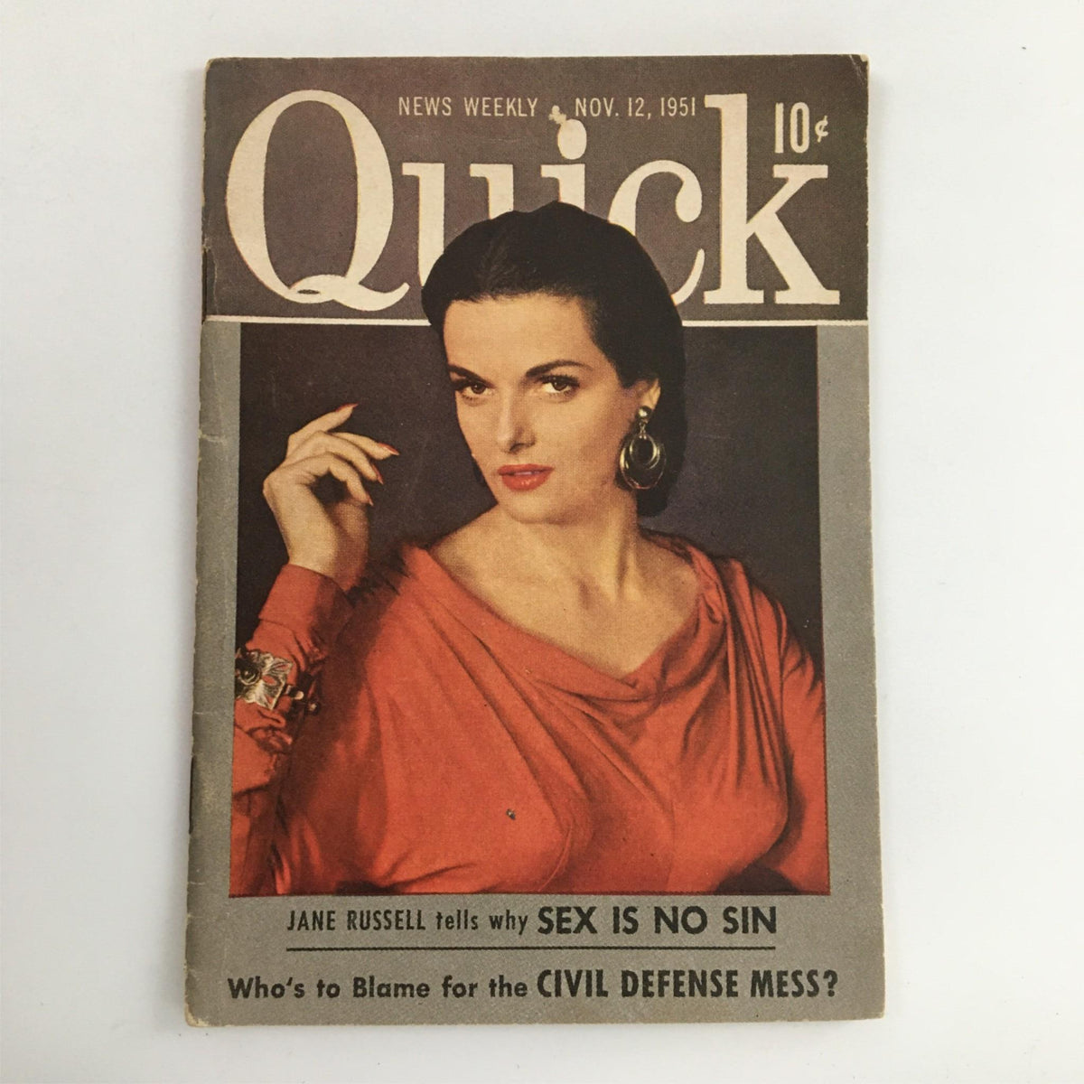 Cover of Quick Magazine from November 12, 1951 featuring Jane Russell. This vintage magazine highlights 1950s culture and entertainment, showcasing Russell in a vibrant red dress with an elegant hairstyle and earrings.