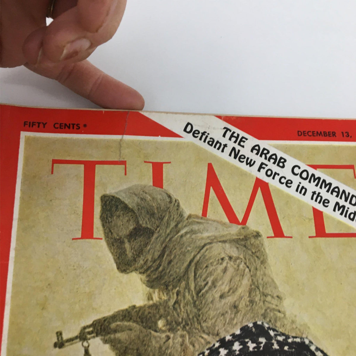Close-up view of the vintage Time Magazine cover from December 13, 1968 featuring Fedayeen Leader Arafat and the headline about Arab Commandos.