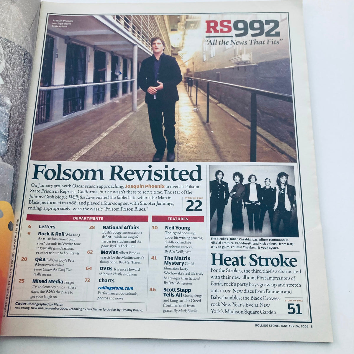 Rolling Stone Magazine January 26 2006 Issue 992 featuring a profile on Neil Young, showcasing a stylish man standing confidently with an urban backdrop, part of the features section.