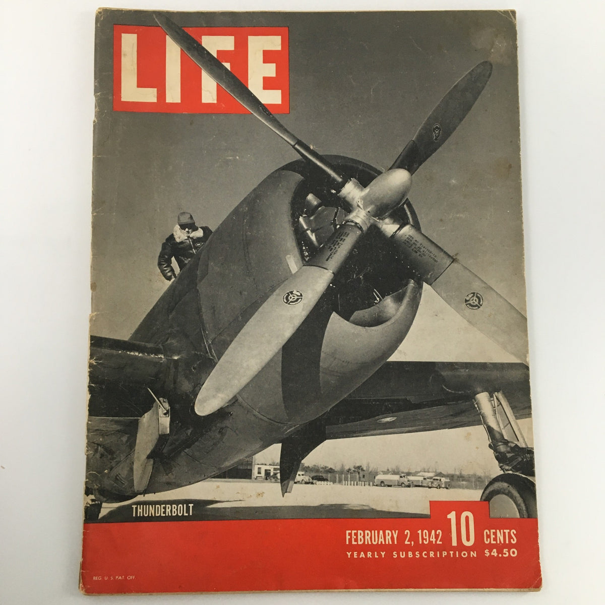 Vintage Life Magazine from February 2, 1942 featuring the XP-47N Thunderbolt on the cover, showcasing a wartime aviation theme.