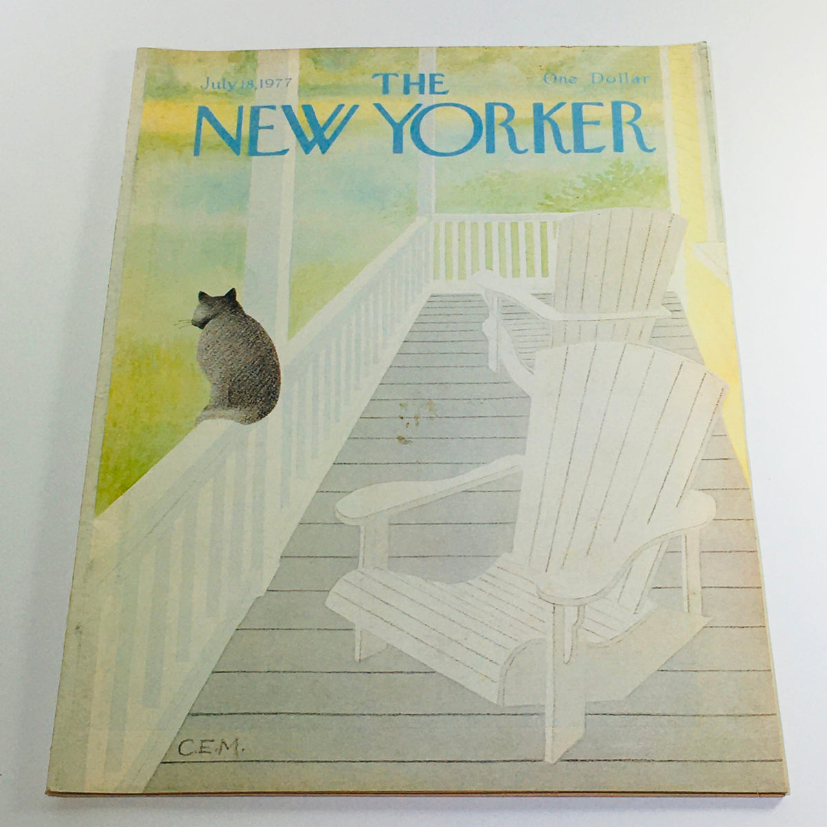 The New Yorker: July 18 1977 Full Magazine Cover featuring a cat on a railing and empty chairs, illustrated by Charles E. Martin, showcasing a serene outdoor setting.