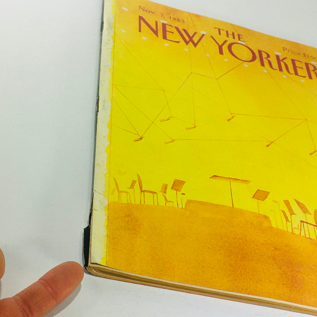 Side view of The New Yorker magazine from November 7, 1983, highlighting the distinctive yellow cover design by Abel Quezada and the magazine's vintage appeal.