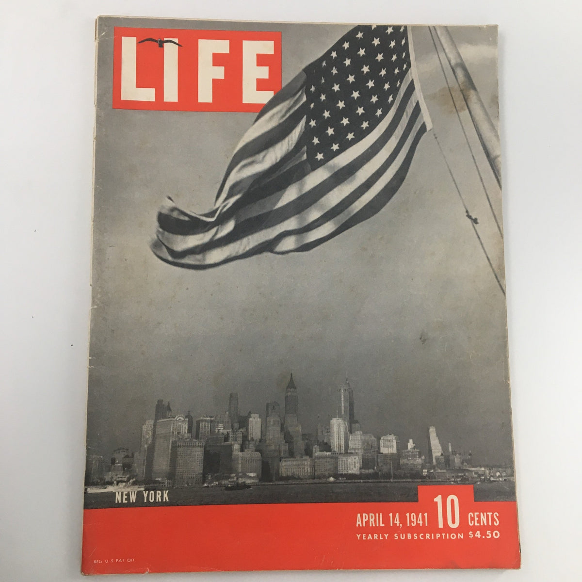 Cover of VTG Life Magazine April 14 1941 featuring the U.S. Flag and a New York City skyline, showcasing iconic Americana.