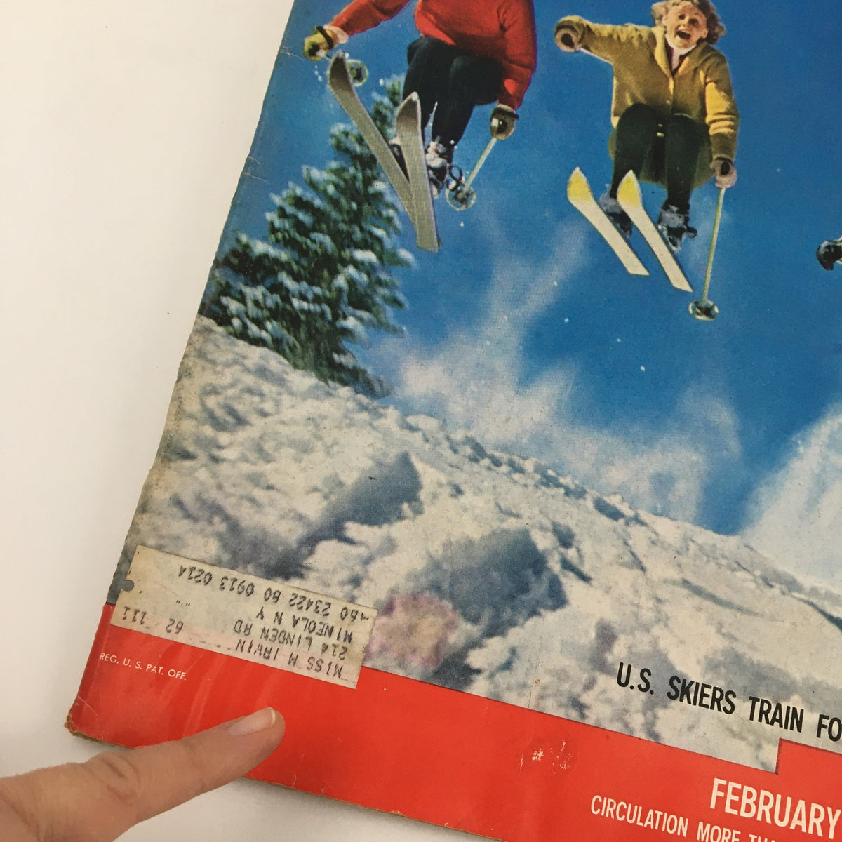 Close-up of the cover of Life Magazine, February 8, 1960, showcasing details of U.S. skiers training for the Olympics, with a focus on the magazine's original label and date.