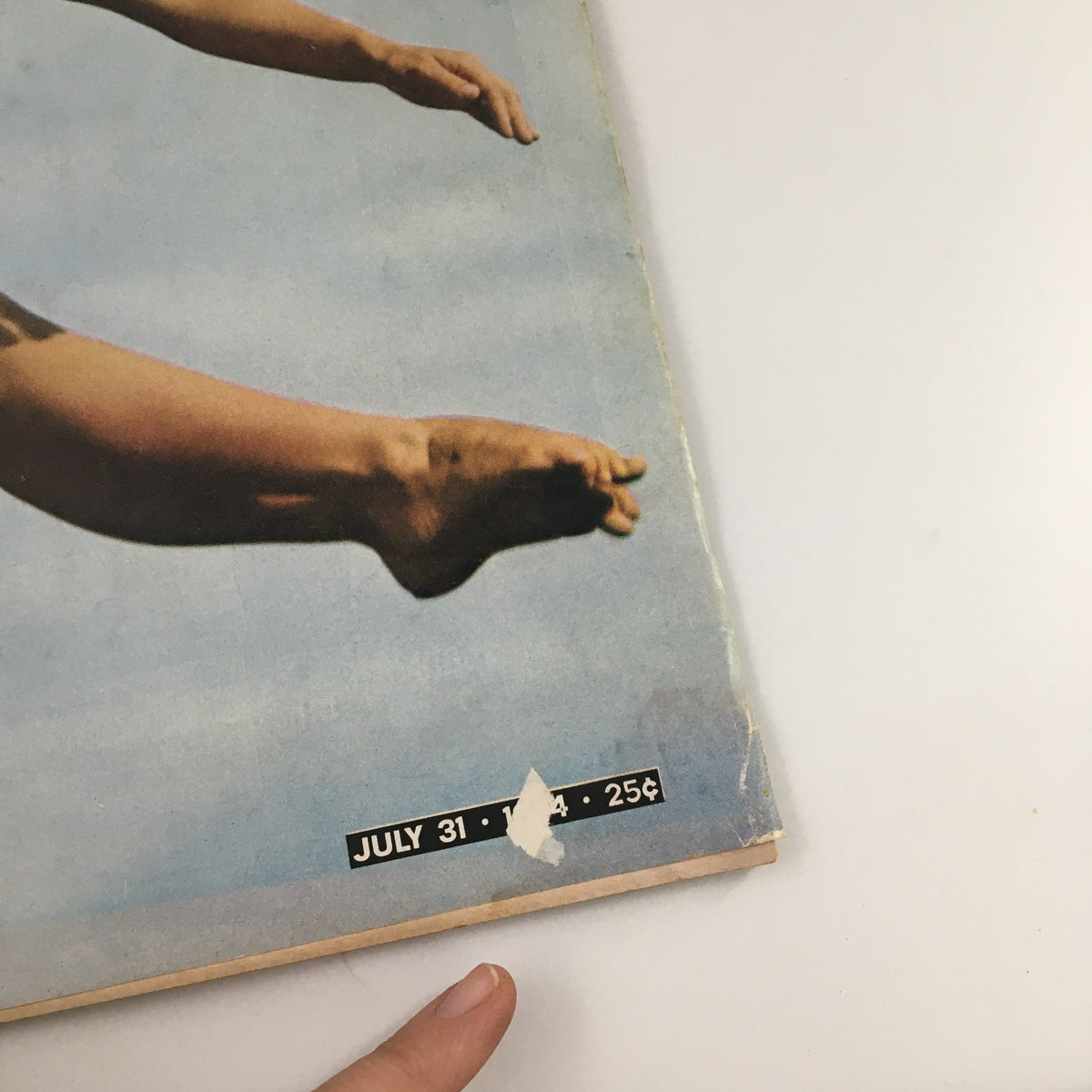 Close-up of the bottom corner of the July 31, 1964 issue of Life Magazine featuring Olympian diver Barbara Talmage, showcasing the price and publication date.