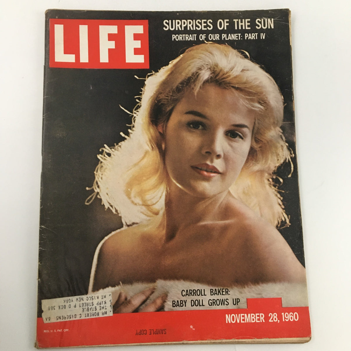 Vintage Life Magazine cover from November 28, 1960, featuring Carroll Baker with the title 'Carroll Baker: Baby Doll Grows Up.' The cover highlights a captivating portrait of the actress, showcasing the magazine's historical significance in reflecting cultural shifts of the 1960s.