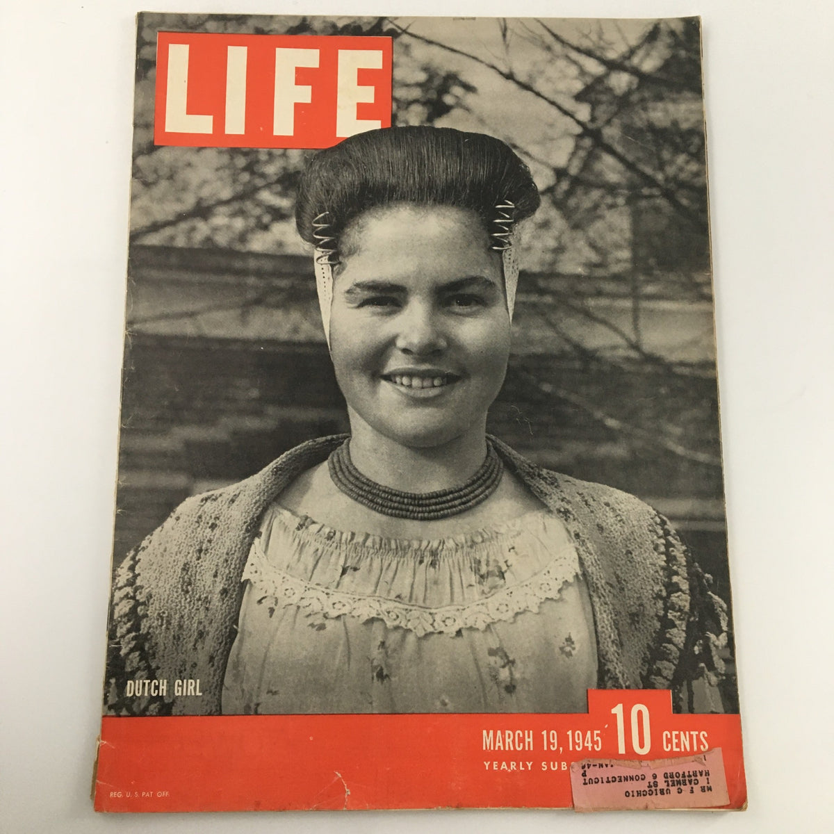 Cover of Life Magazine dated March 19, 1945, featuring a Dutch girl wearing traditional dress, showcasing cultural heritage and historical significance from the 1940s.