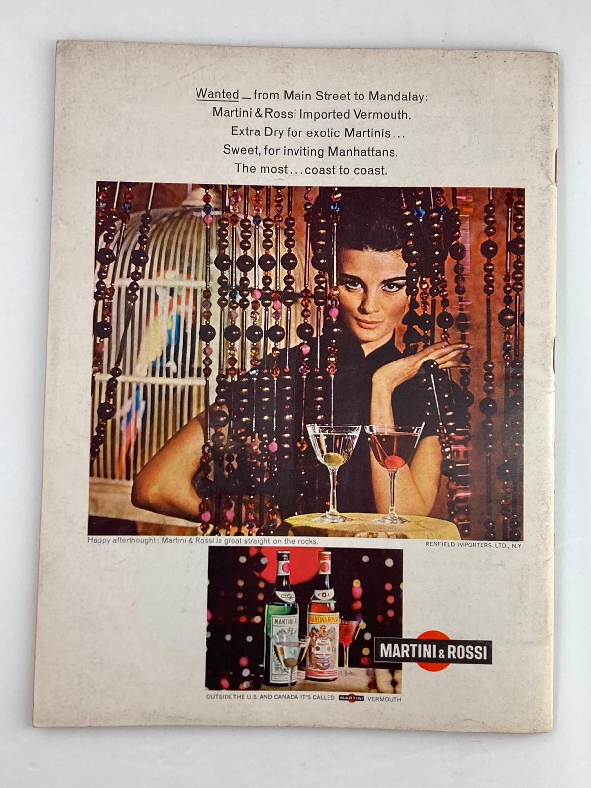 Back cover of VTG Newsweek Magazine March 21, 1966 displaying an advertisement for Martini & Rossi Imported Vermouth with a glamorous woman holding cocktails, promoting their unique drink offerings.