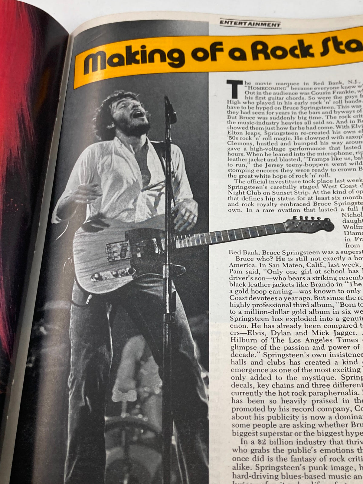 Close-up of Bruce Springsteen performing live in an article titled 'Making of a Rock Star' from VTG Newsweek Magazine October 27 1975.