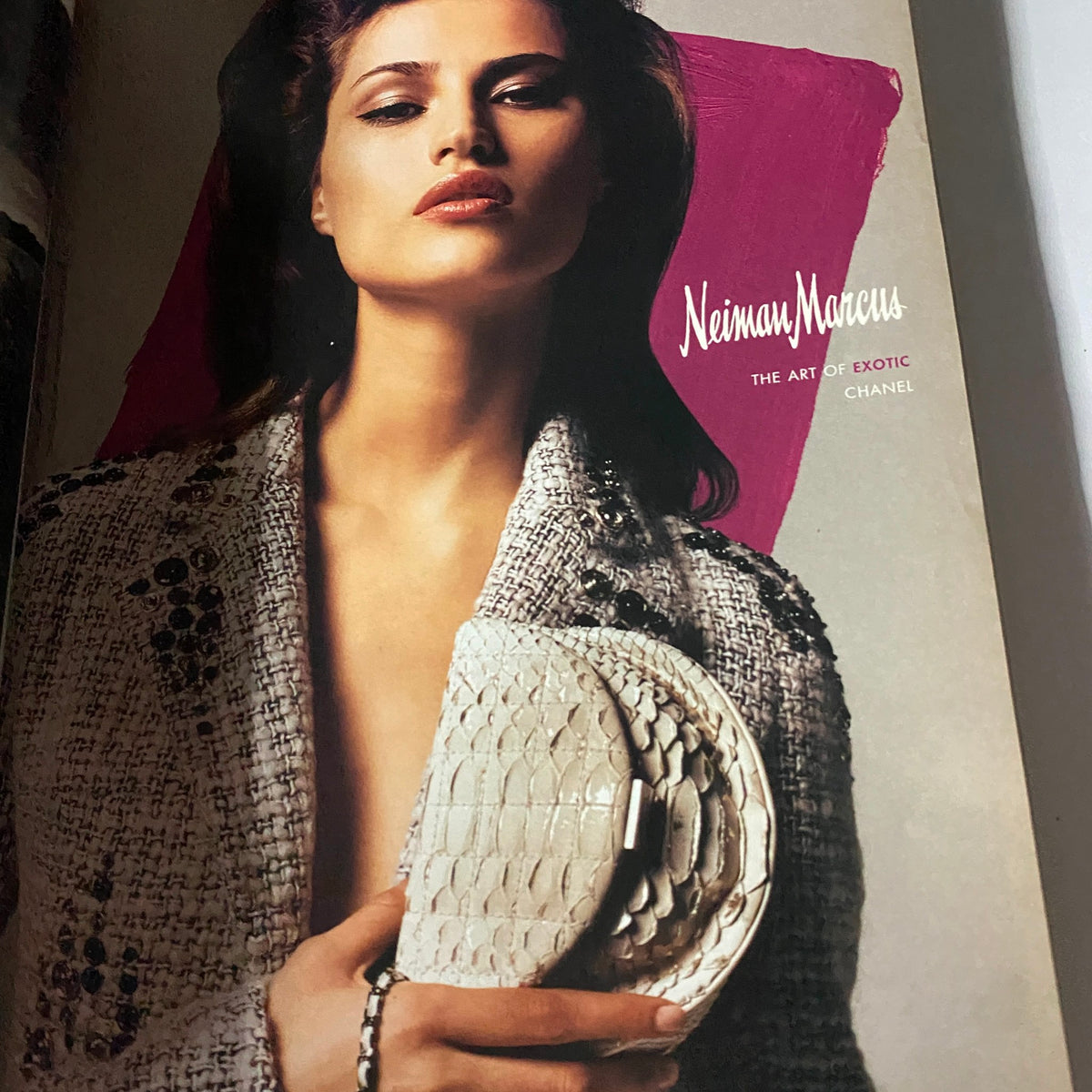 W Magazine October 2003 cover featuring a model in a sophisticated outfit holding a chic handbag, showcasing high-fashion elements related to Neiman Marcus and Chanel.