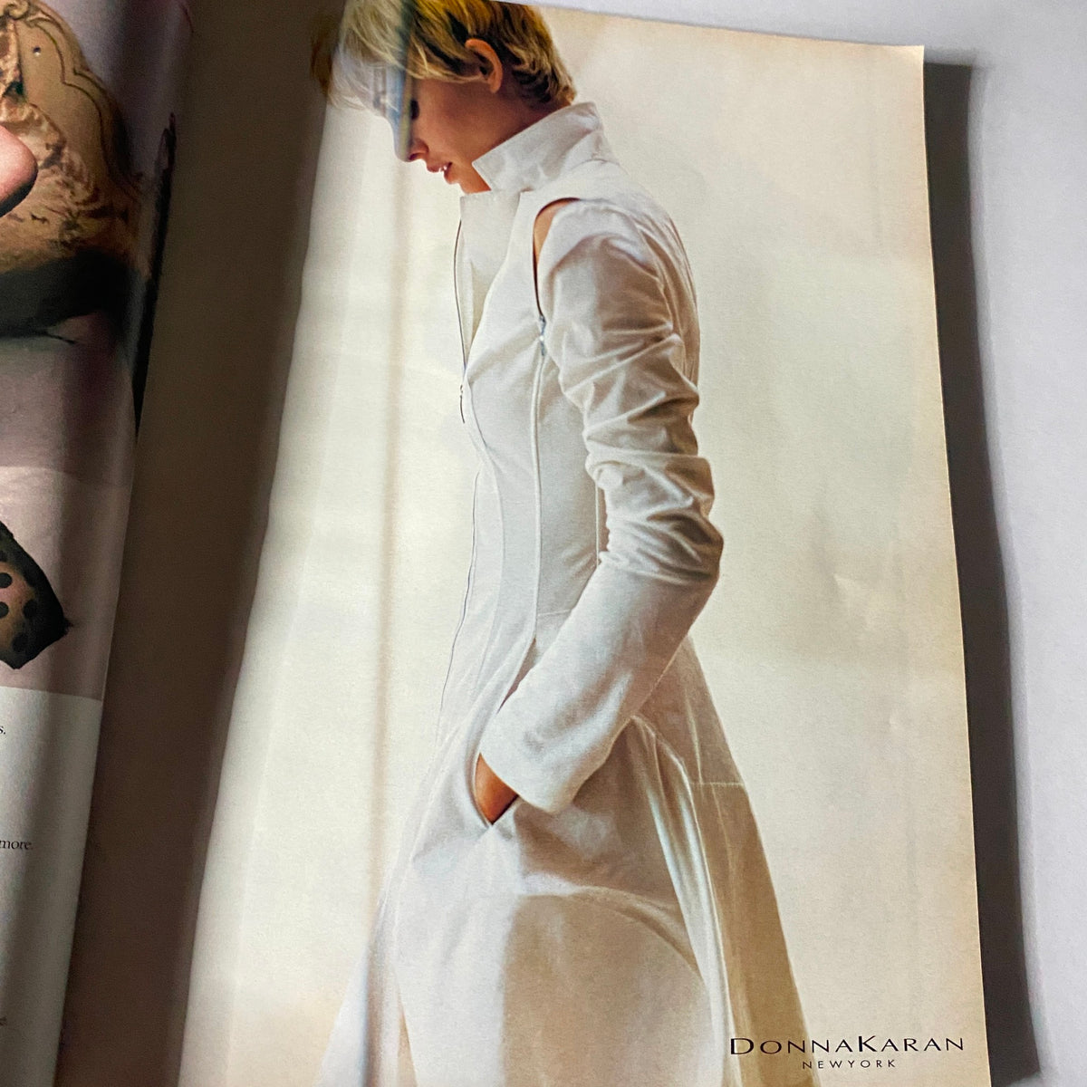 Fashion advertisement from W Magazine March 2002 showcasing a model in a white outfit, part of the vintage issue featuring Julia Roberts.