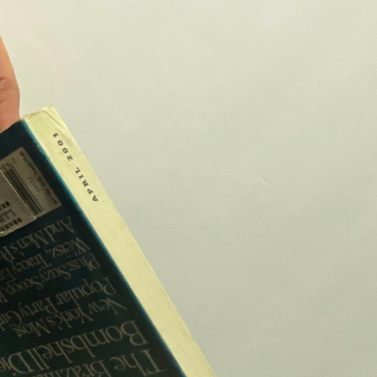 Spine of the W Magazine April 2001 issue, highlighting the date and providing a glimpse of the magazine's collectible character.